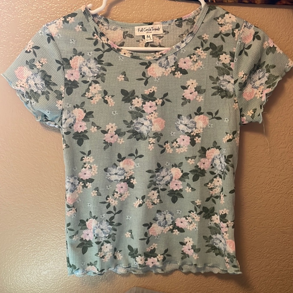 Green shirt with pink flowers. Size:M- fits like a SMALL.